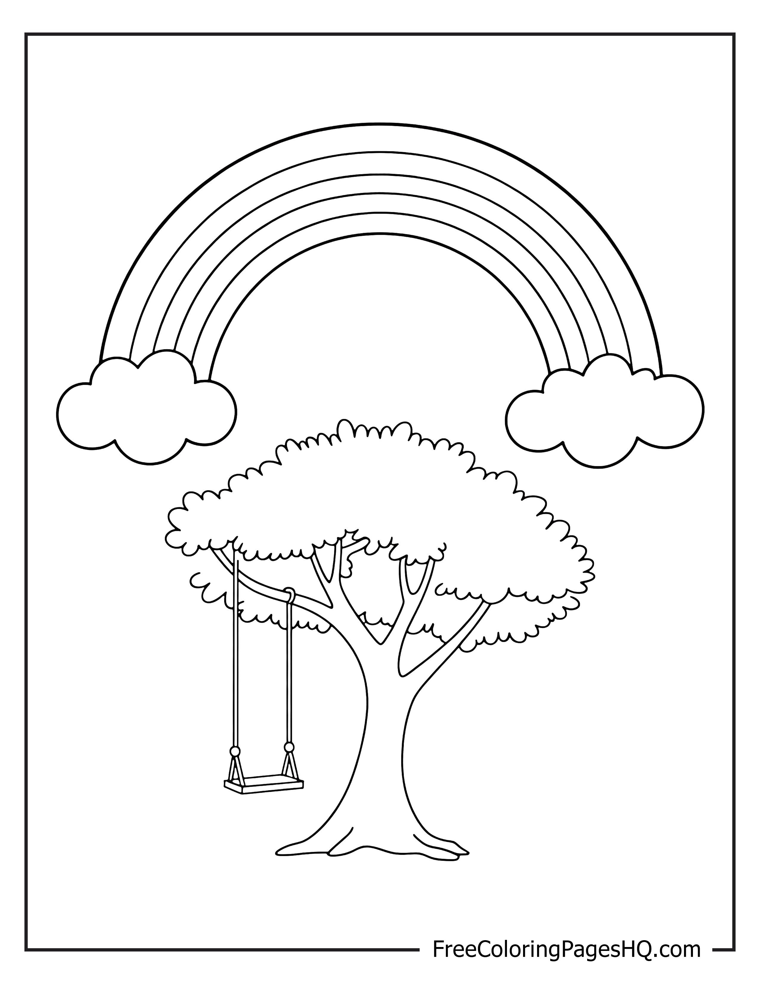 Image of a rainbow over a tree with a swing.