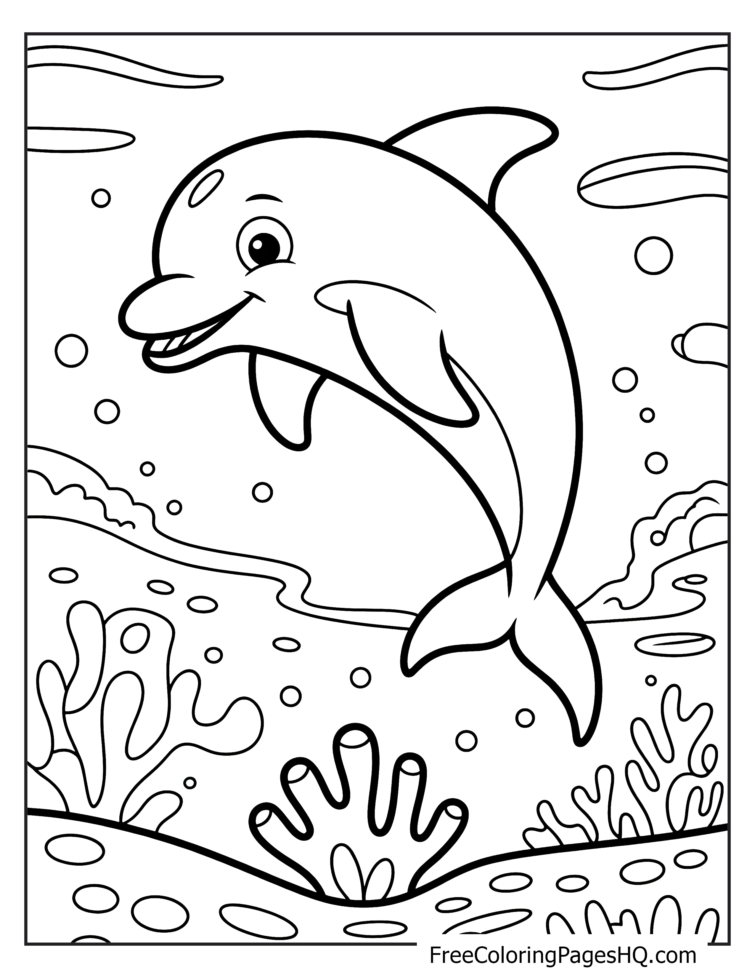 3. A cheerful dolphin swims above colorful coral under the sea.