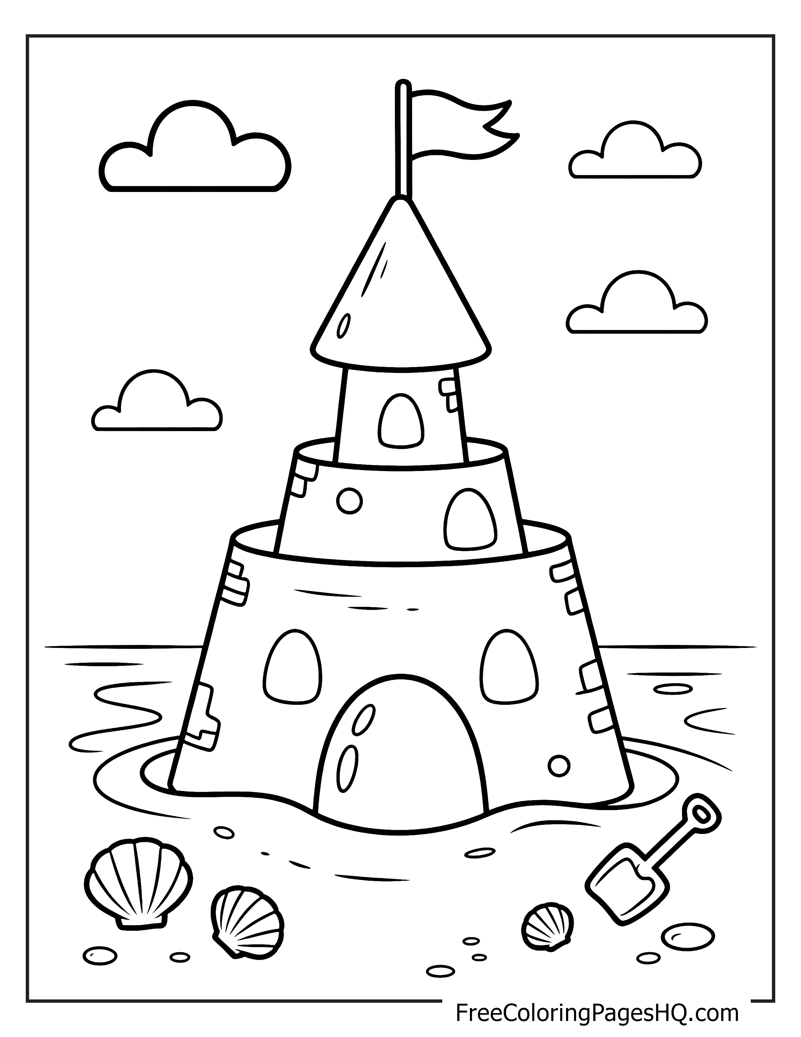 A sandcastle with a flag at the beach, shells, and clouds in the sky.