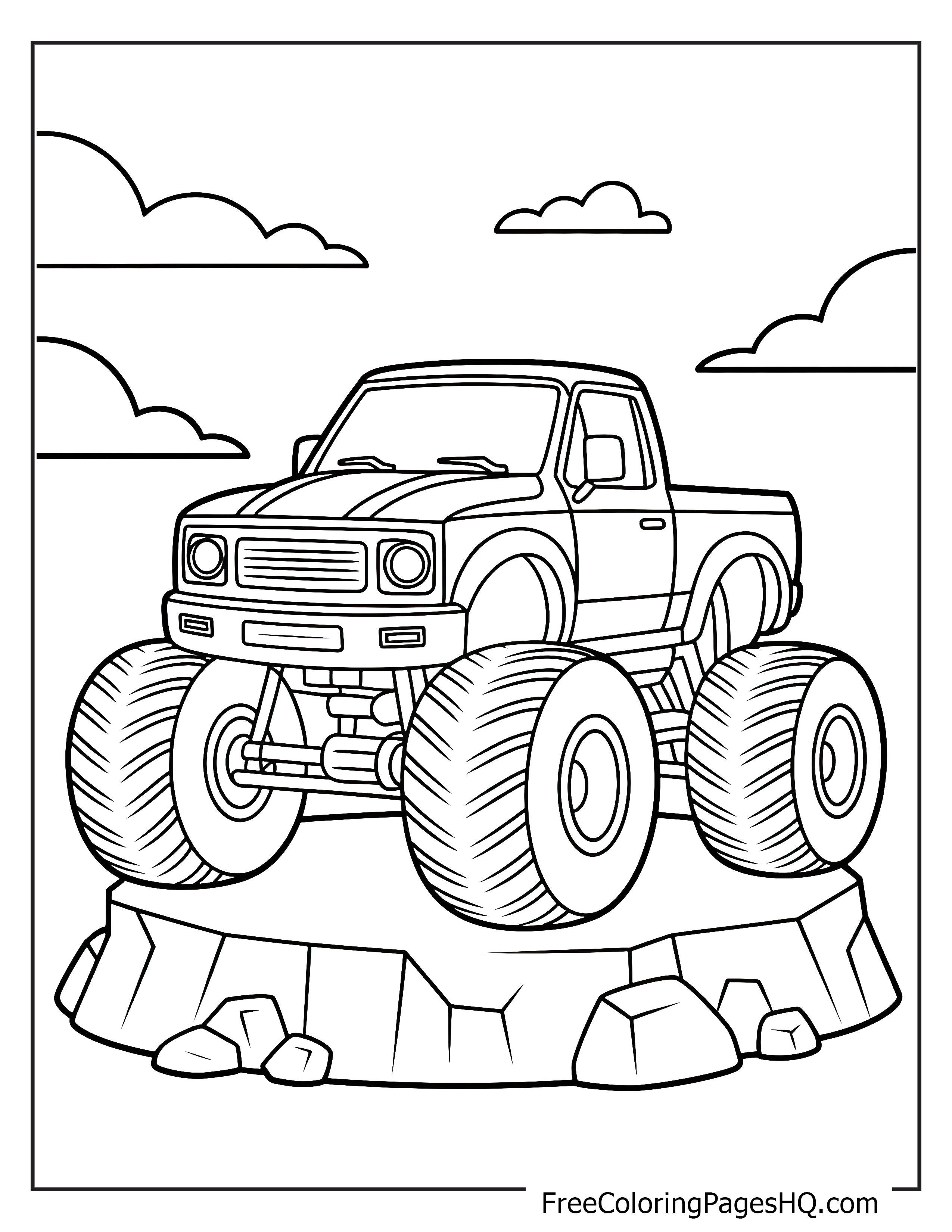 Monster truck on rocks with clouds in the background.
