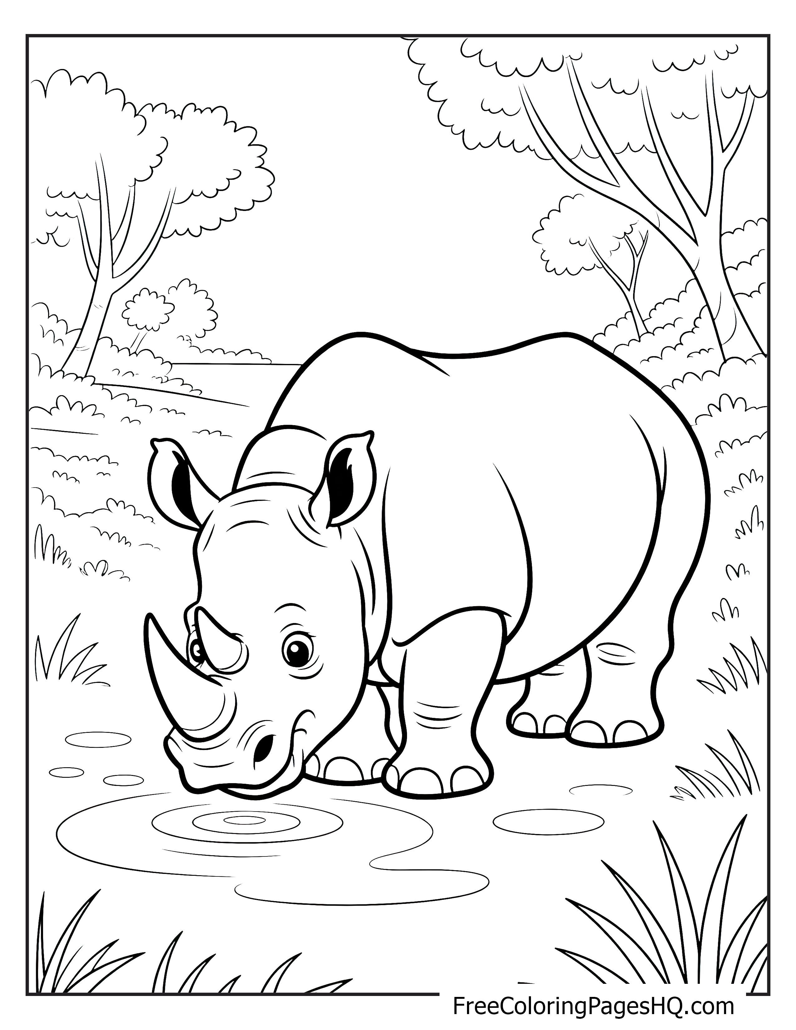 A rhino standing by a pond in a forested area, drinking water with trees in the background.